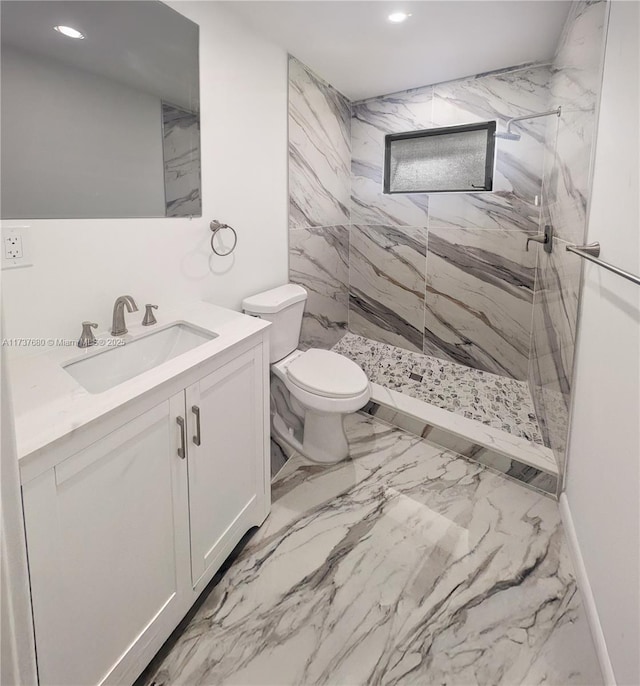 bathroom with a marble finish shower, vanity, toilet, and recessed lighting