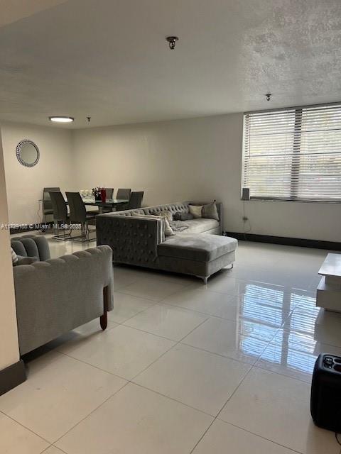 living room with light tile patterned flooring