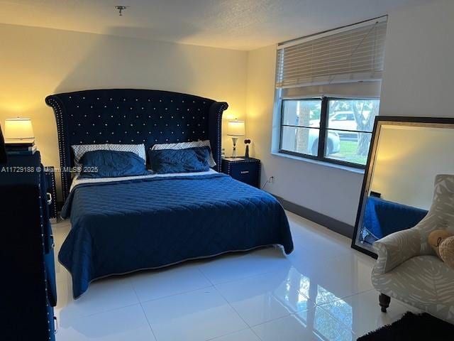 bedroom featuring tile patterned flooring