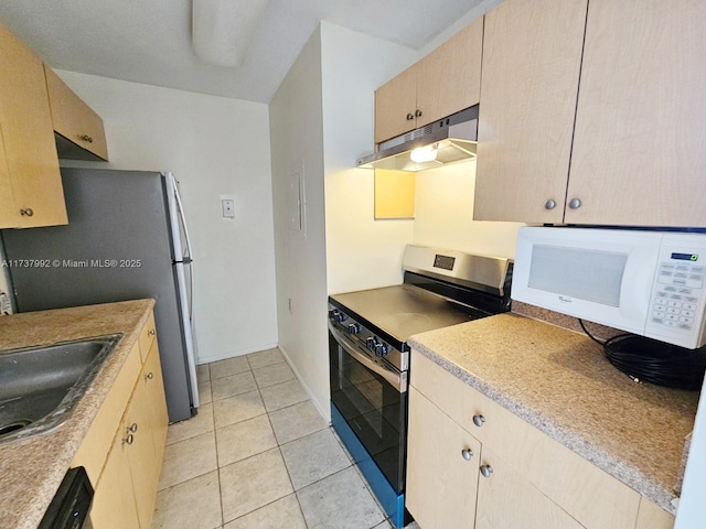 kitchen featuring appliances with stainless steel finishes, sink, light brown cabinets, and light tile patterned floors