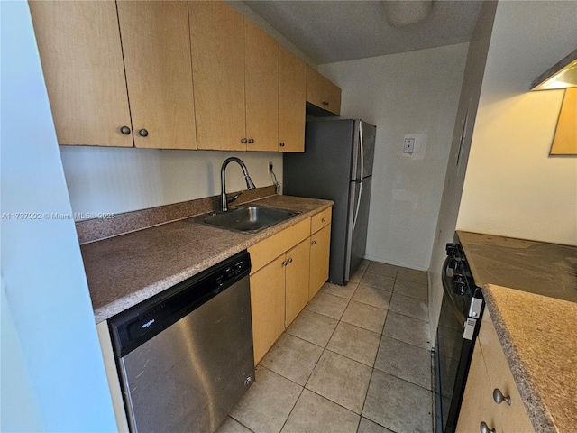 kitchen with sink, light tile patterned floors, stainless steel appliances, and light brown cabinets