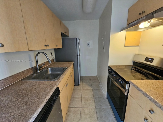 kitchen with light tile patterned flooring, appliances with stainless steel finishes, sink, and light brown cabinets