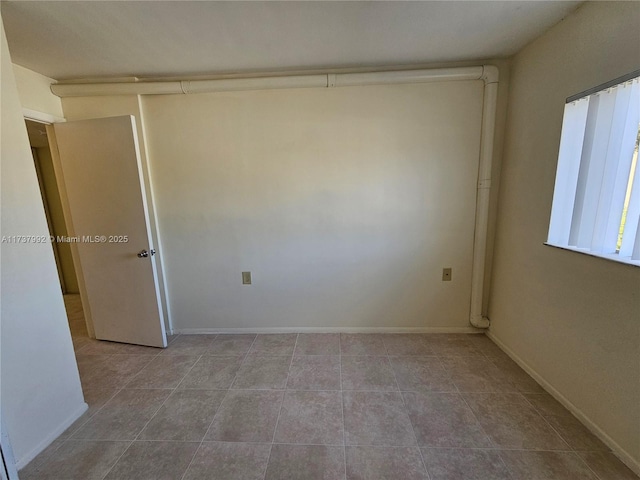 view of tiled spare room