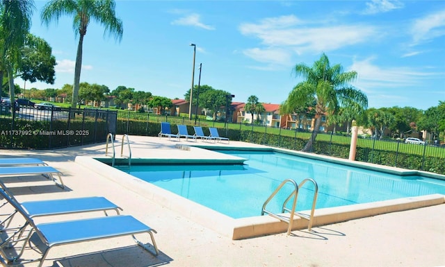 view of swimming pool with a patio