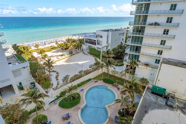 aerial view featuring a water view and a beach view