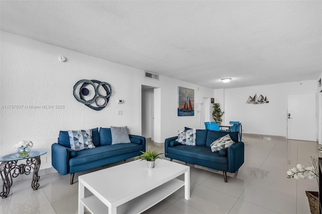 living room featuring a textured ceiling