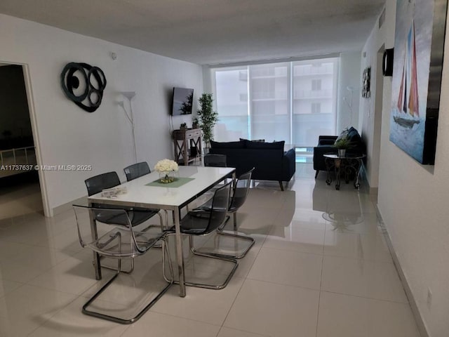 dining area featuring light tile patterned floors