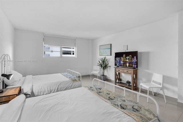 bedroom featuring baseboards