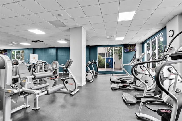 gym with visible vents and a drop ceiling