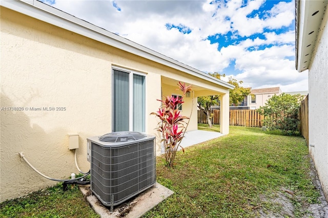 view of yard featuring cooling unit and a patio