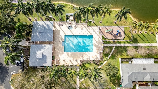 birds eye view of property with a water view