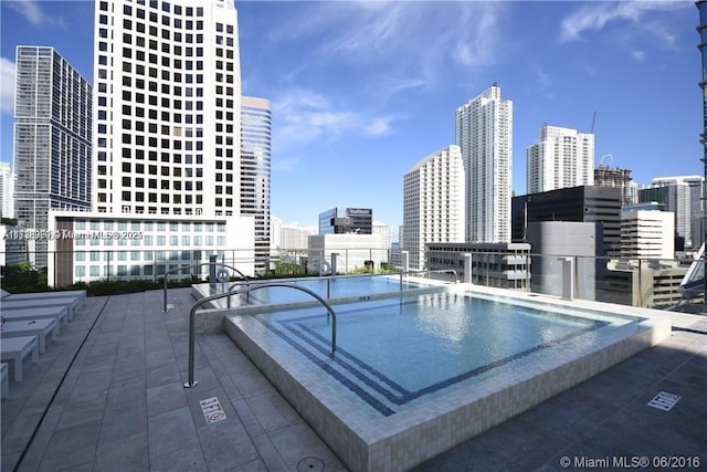 view of pool featuring a patio area