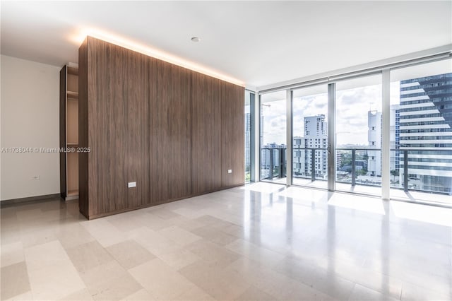 spare room featuring expansive windows