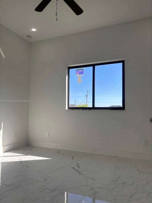 unfurnished room with ceiling fan