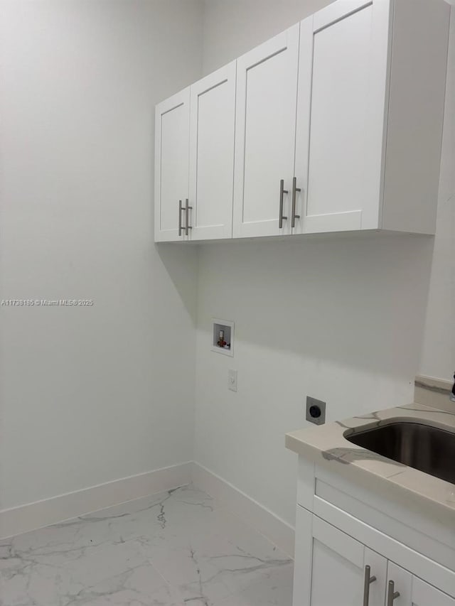 laundry area with cabinets, sink, hookup for an electric dryer, and hookup for a washing machine