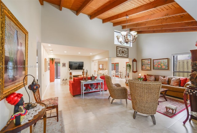 dining area with an inviting chandelier, beam ceiling, wooden ceiling, and a high ceiling