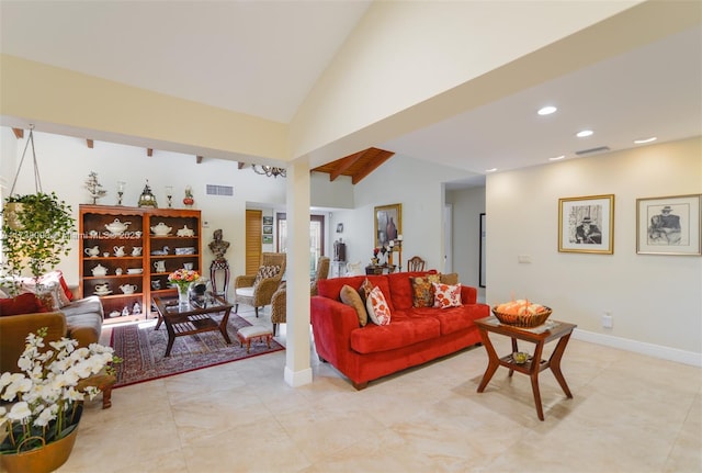 living room with high vaulted ceiling