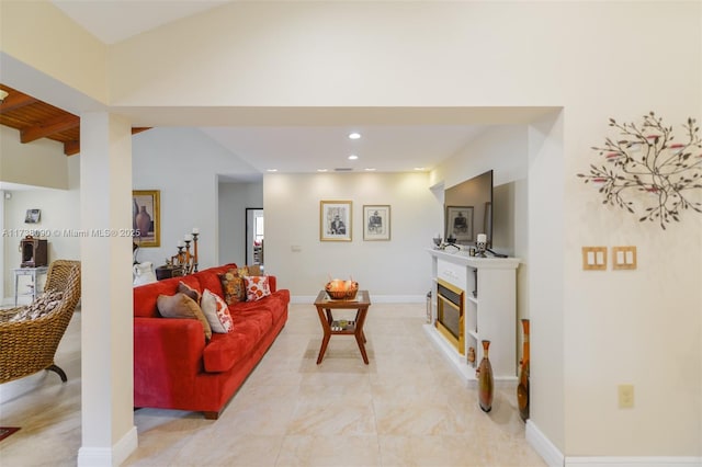 living room with lofted ceiling with beams