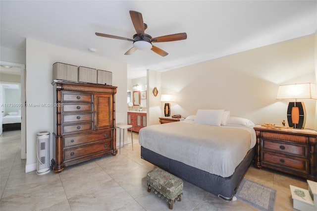 bedroom featuring ceiling fan and ensuite bathroom