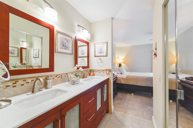 bathroom featuring tile patterned floors, decorative backsplash, and vanity