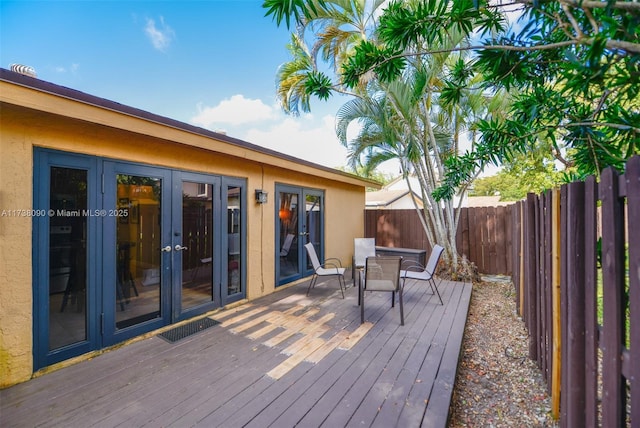 wooden terrace featuring french doors