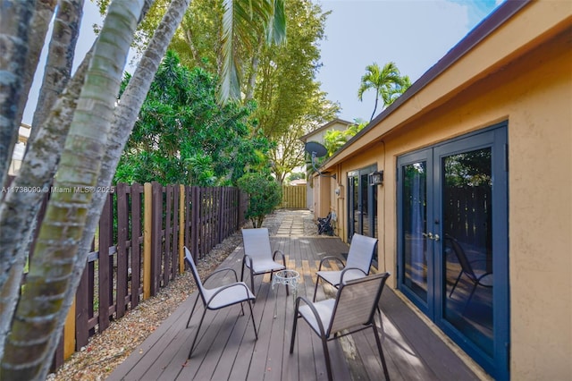 wooden terrace featuring french doors