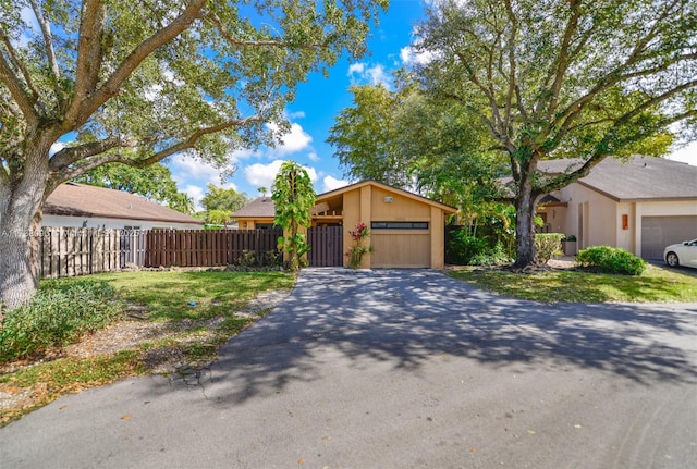 single story home featuring a garage