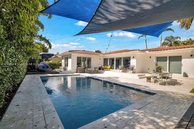 view of pool featuring a patio area