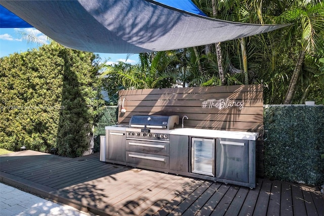 deck featuring grilling area and exterior kitchen