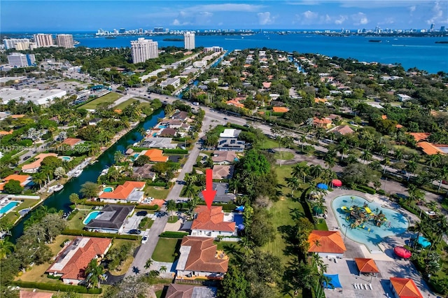 birds eye view of property featuring a water view