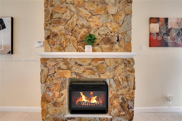 room details featuring a stone fireplace