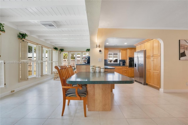 dining space featuring beamed ceiling, wood ceiling, crown molding, and light tile patterned floors