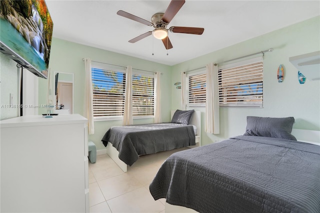 bedroom featuring ceiling fan and light tile patterned floors