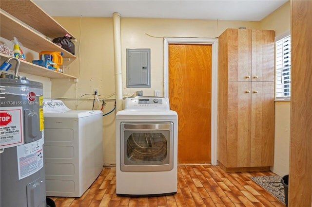 laundry area with water heater, electric panel, and independent washer and dryer