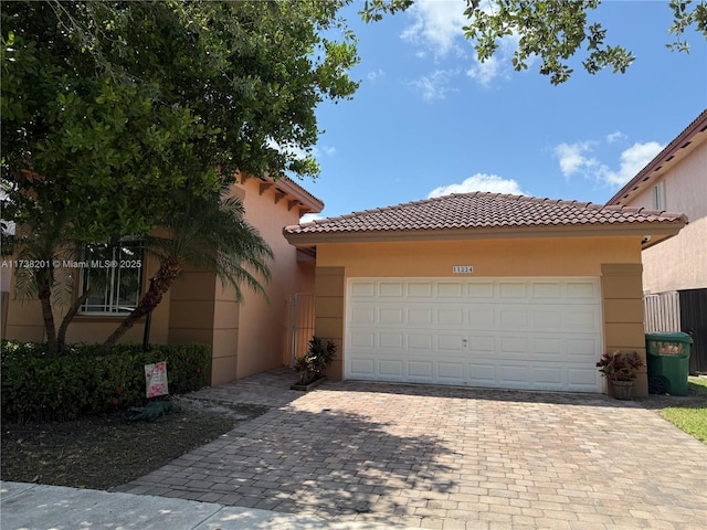 11224 SW 231st Ln, Miami, FL 33170 - mediterranean / spanish-style house featuring a tile roof, driveway, and stucco siding