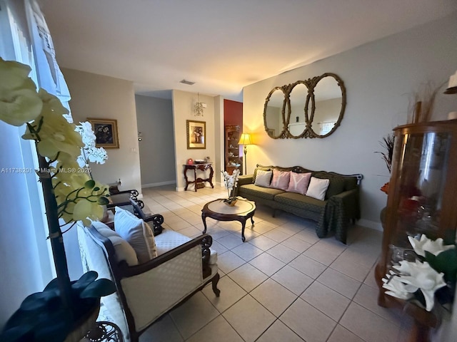 living area with light tile patterned floors and visible vents