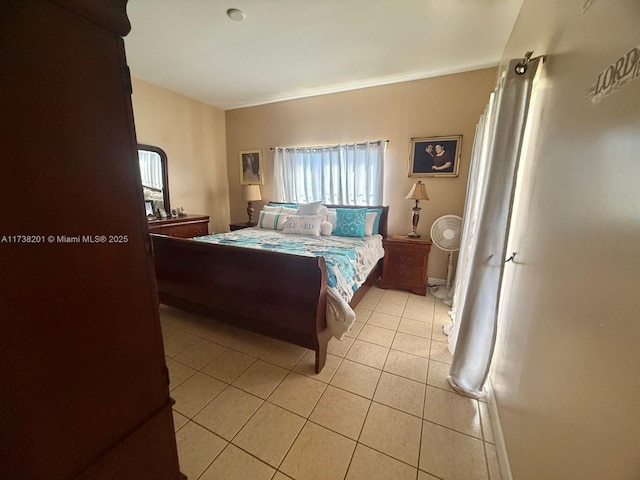 bedroom with light tile patterned floors