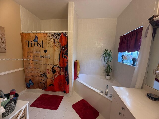 bathroom featuring vanity, shower with separate bathtub, and tile patterned floors