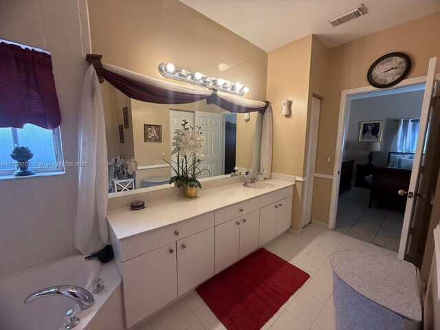11224 SW 231st Ln, Miami, FL 33170 - bathroom featuring tile patterned flooring, vanity, and a tub