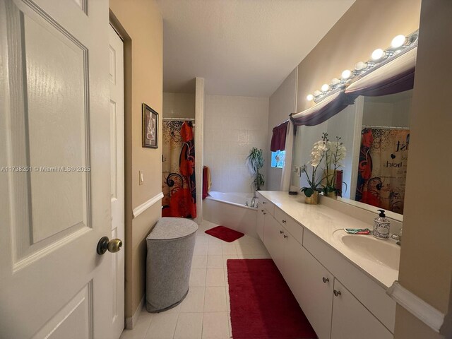 11224 SW 231st Ln, Miami, FL 33170 - bathroom with vanity, a tub, curtained shower, and tile patterned flooring
