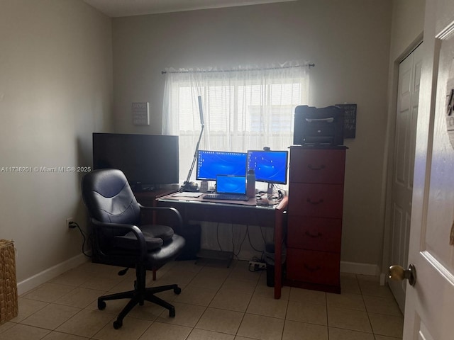 office with light tile patterned floors and baseboards