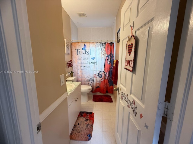 full bath featuring toilet, a shower with shower curtain, visible vents, vanity, and tile patterned floors