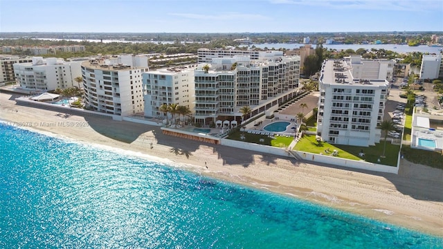 bird's eye view with a view of the beach and a water view