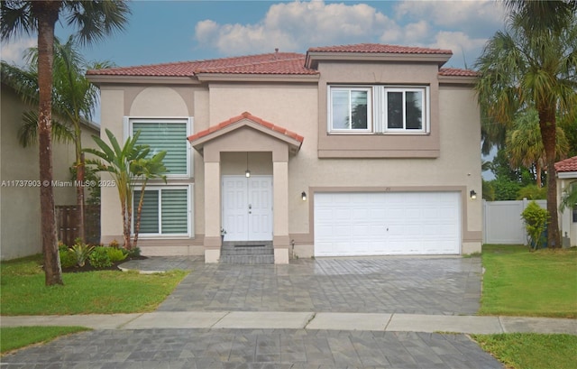 mediterranean / spanish-style home featuring a garage