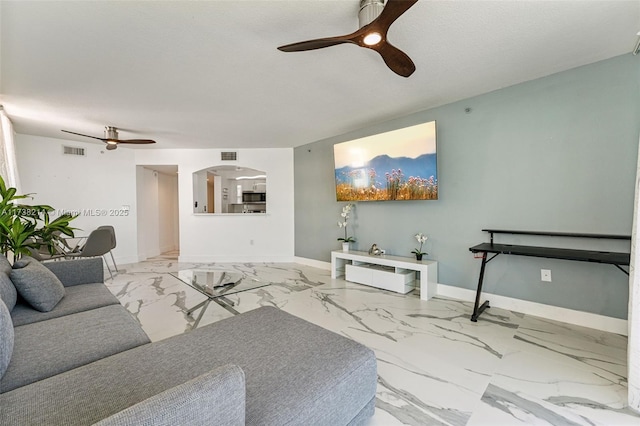 living room featuring ceiling fan