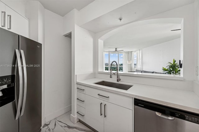 kitchen with white cabinetry, sink, ceiling fan, and appliances with stainless steel finishes