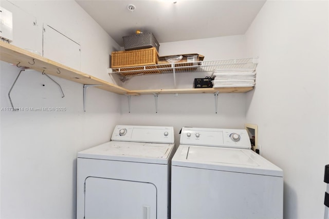 clothes washing area featuring washing machine and dryer