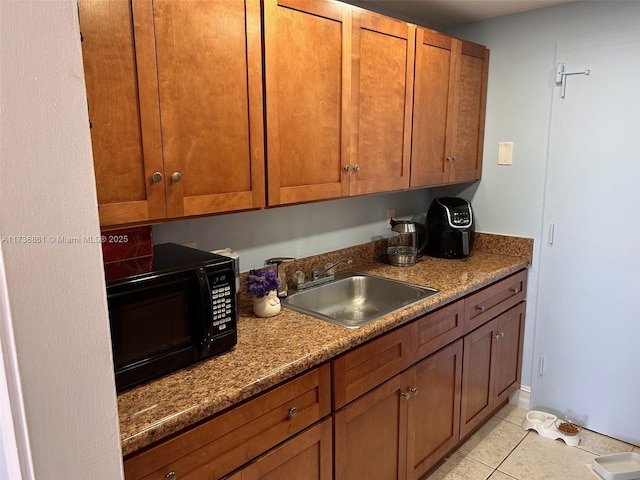 kitchen with sink and light tile patterned floors