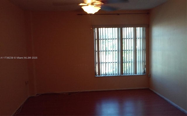 empty room with plenty of natural light and ceiling fan