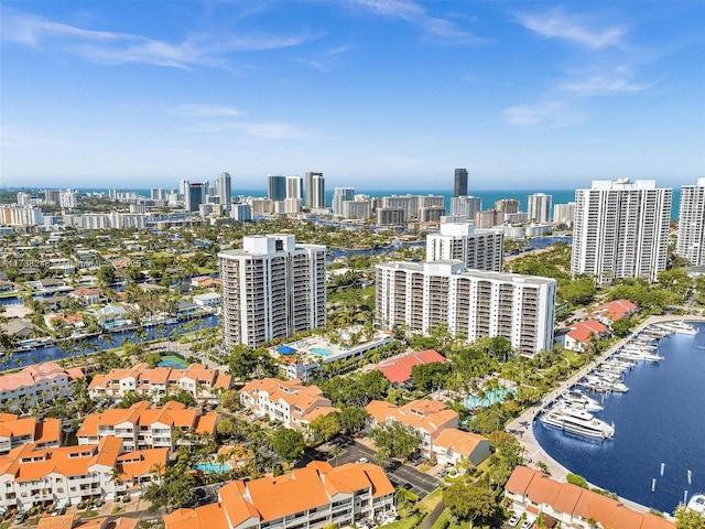 drone / aerial view featuring a water view and a city view